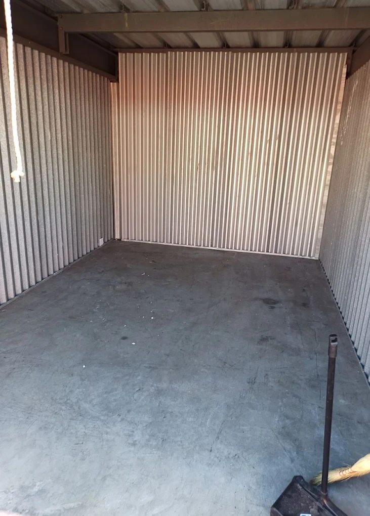 After photo of the same storage unit completely emptied and swept